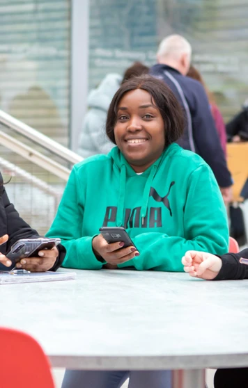Student sitting in a communal area at Glasgow Kelvin College’s East End Campus, working or relaxing in a modern, shared space. Student sitting in a communal area at Glasgow Kelvin College’s East End Campus, working or relaxing in a modern, shared space.